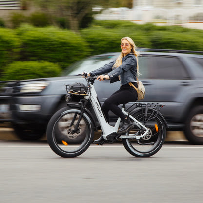 Young woman riding white Kingbull Discover ST electric bike, demonstrating comfortable step-through design
