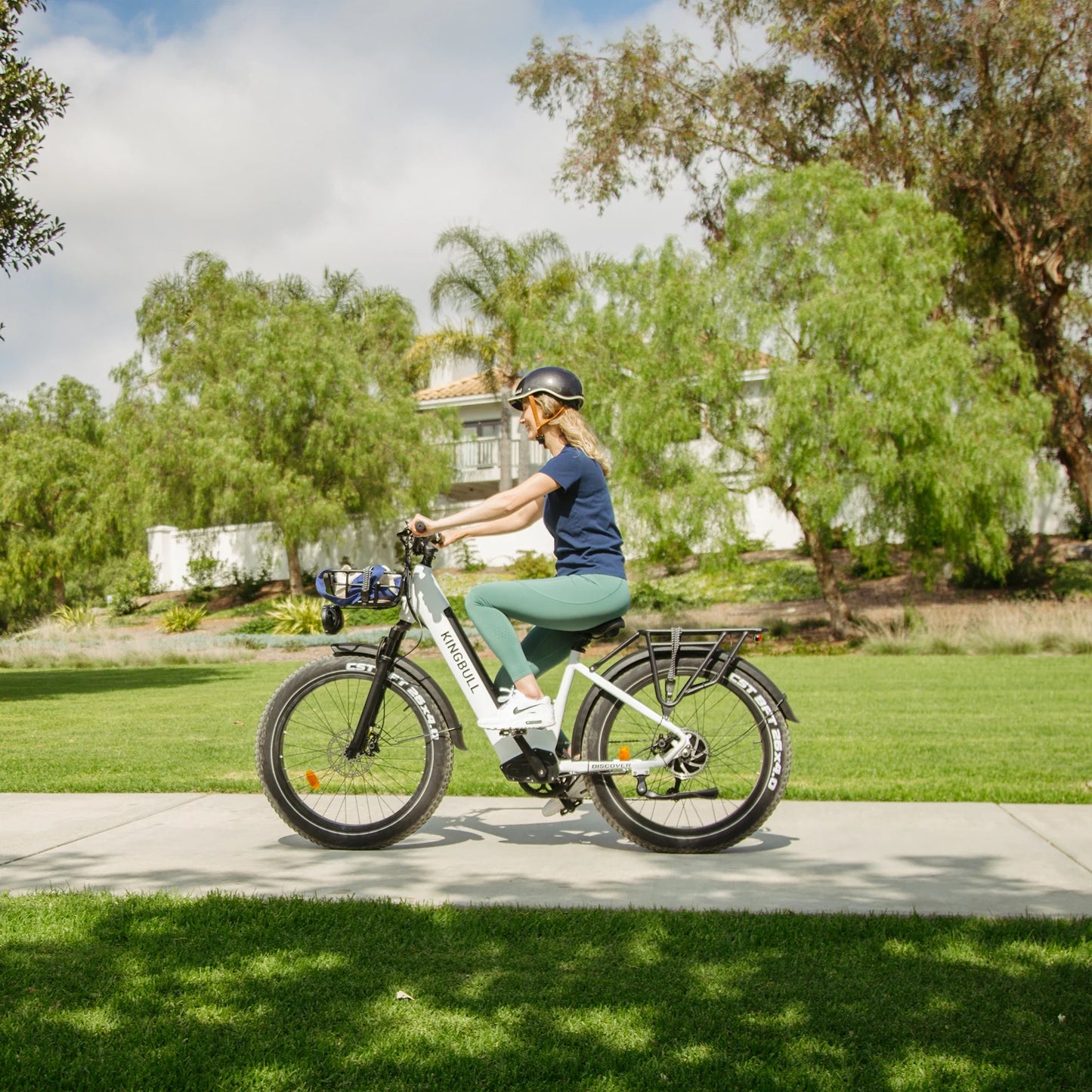 Young woman riding Kingbull Discover ST electric bike, demonstrating comfortable step-through design