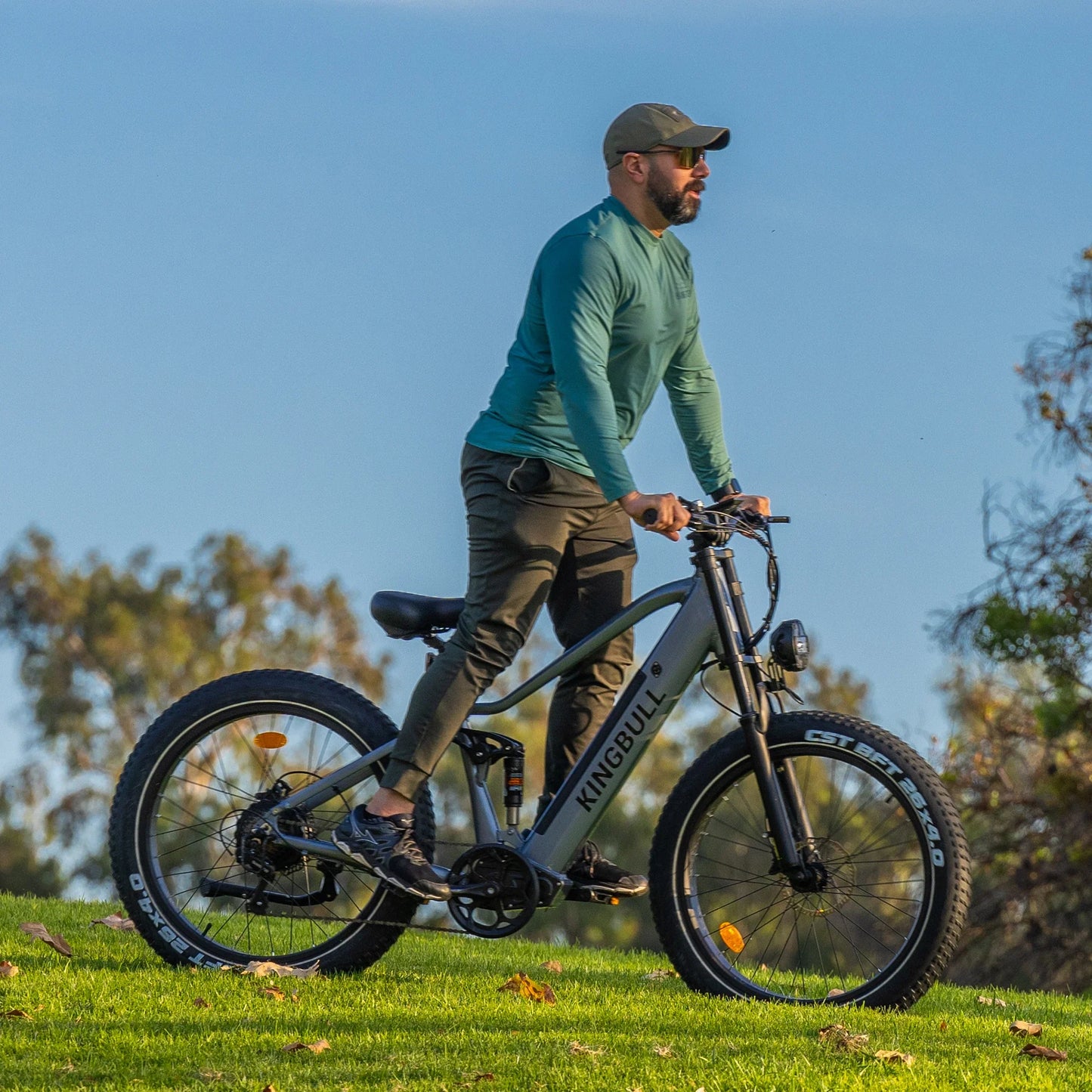 A man Riding the Kingbull Rover Ebike on outdoor grass