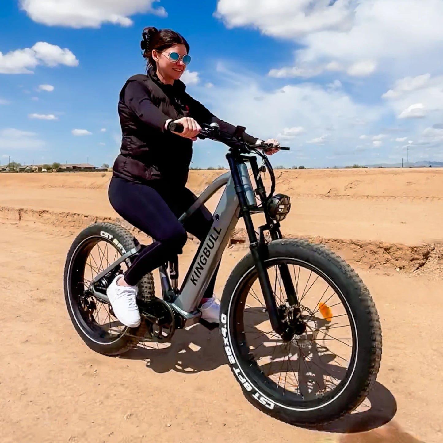 A woman riding the Kingbull Rover Ebike on outdoor trail