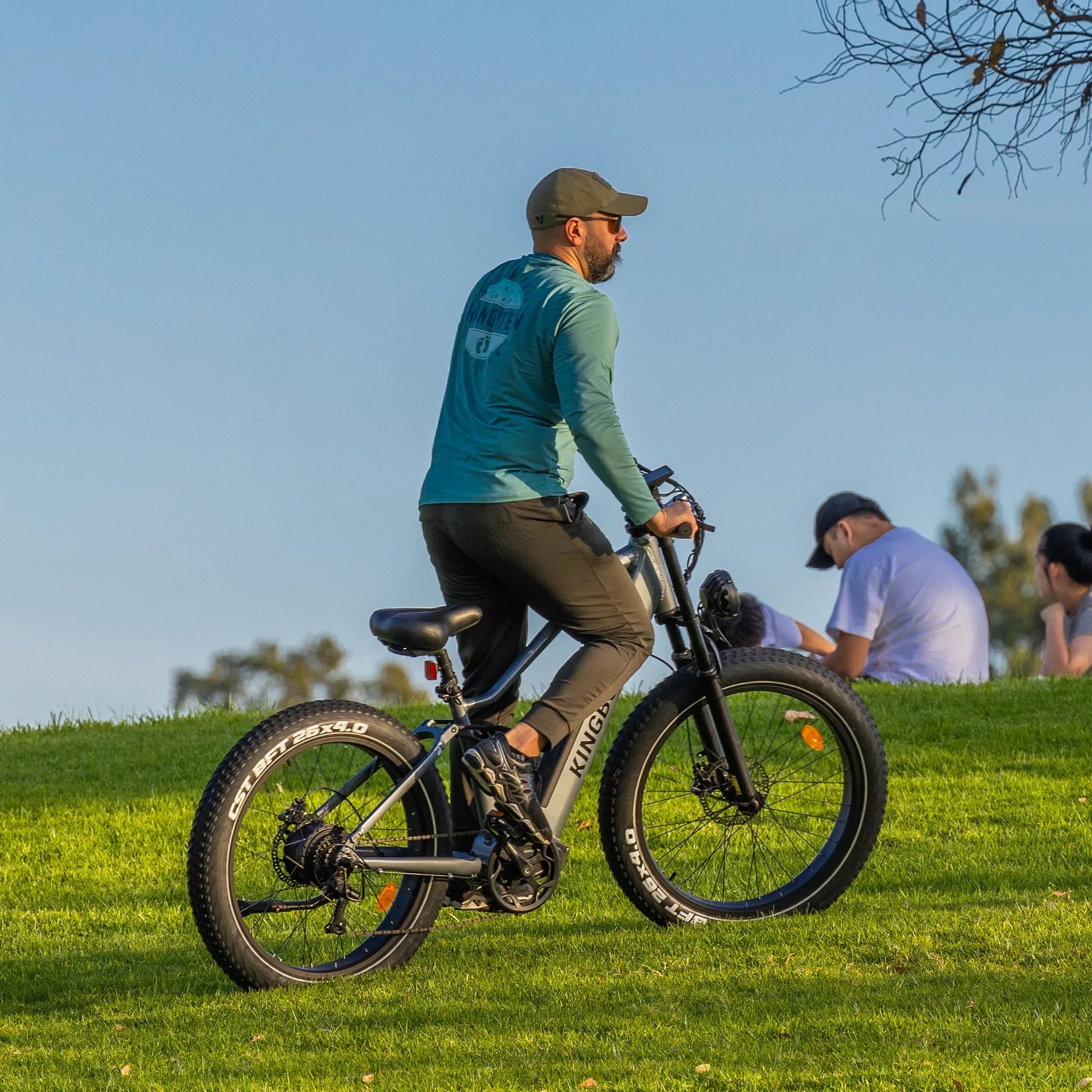 A man Riding the Kingbull Rover Ebike on outdoor grass