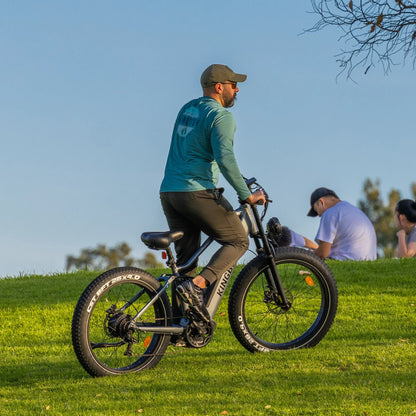 A man Riding the Kingbull Rover Ebike on outdoor grass