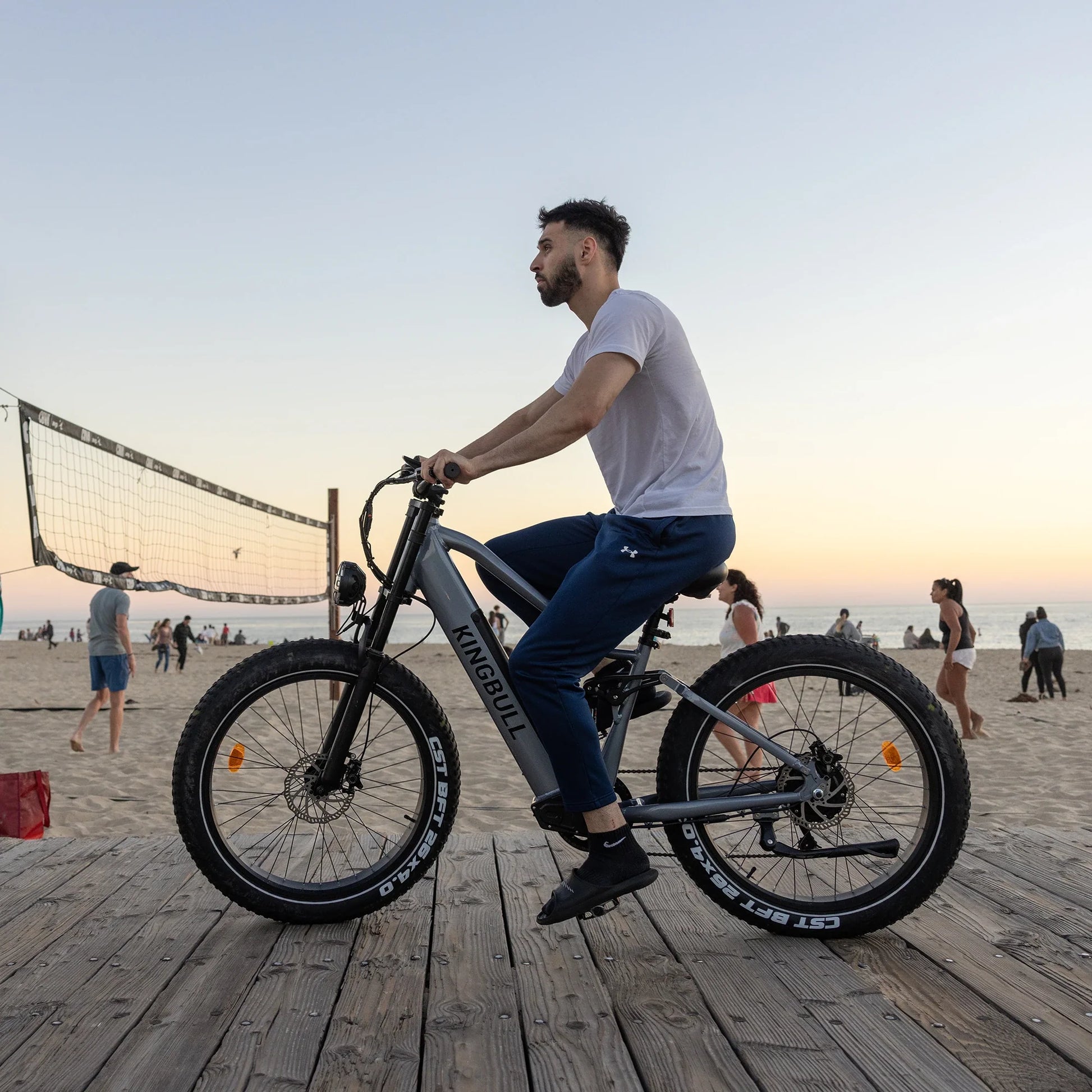A man rides Kingbull rover ebike On the beach